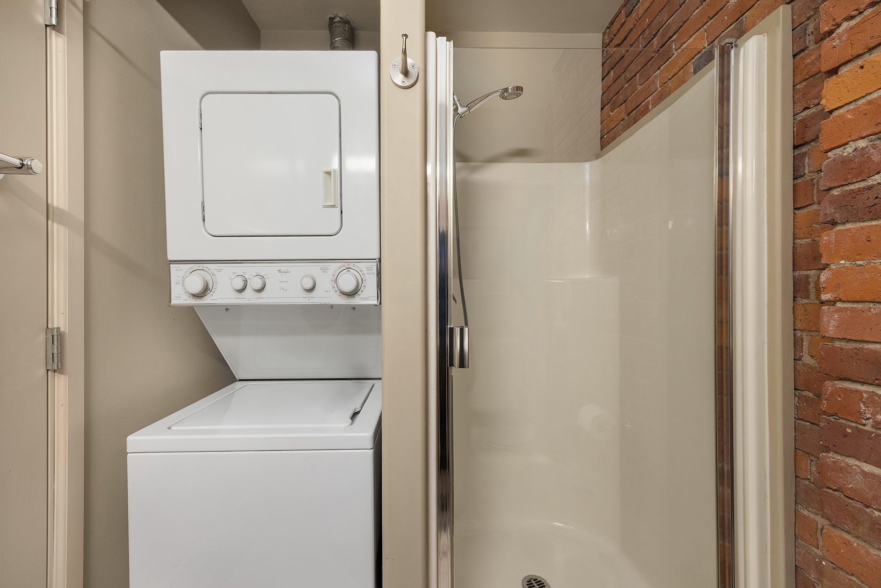 Living room with original brick walls